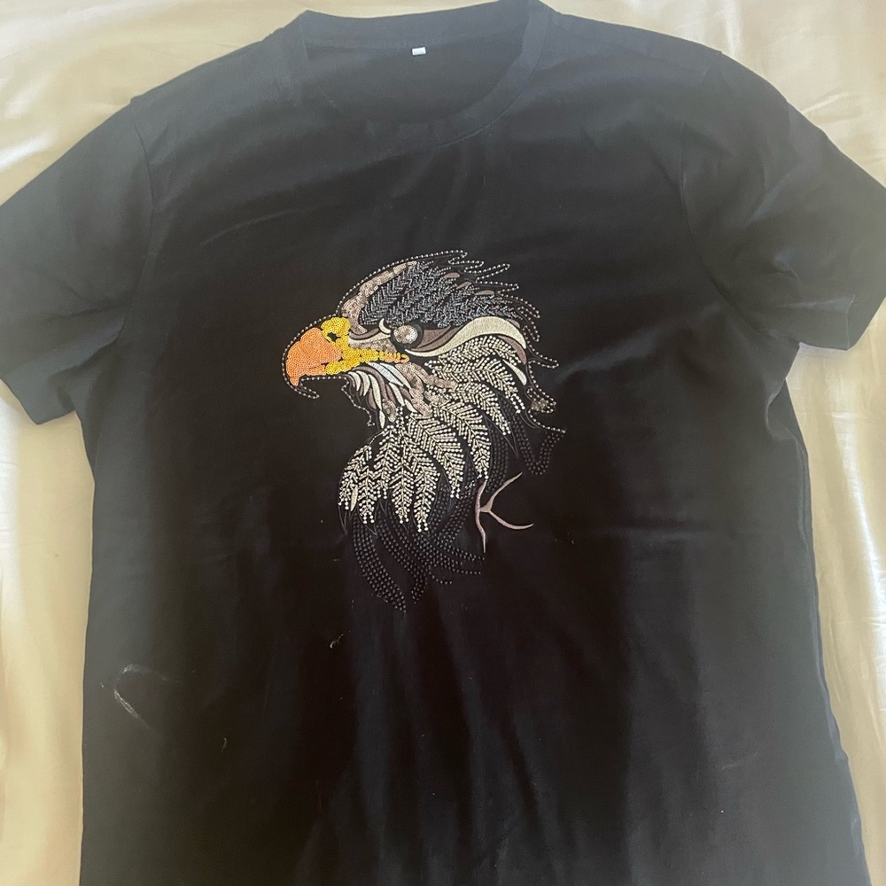 Black shirt with an eagle made out of rhinestones